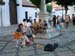 singer in square with kids