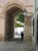 woman walking through arc
